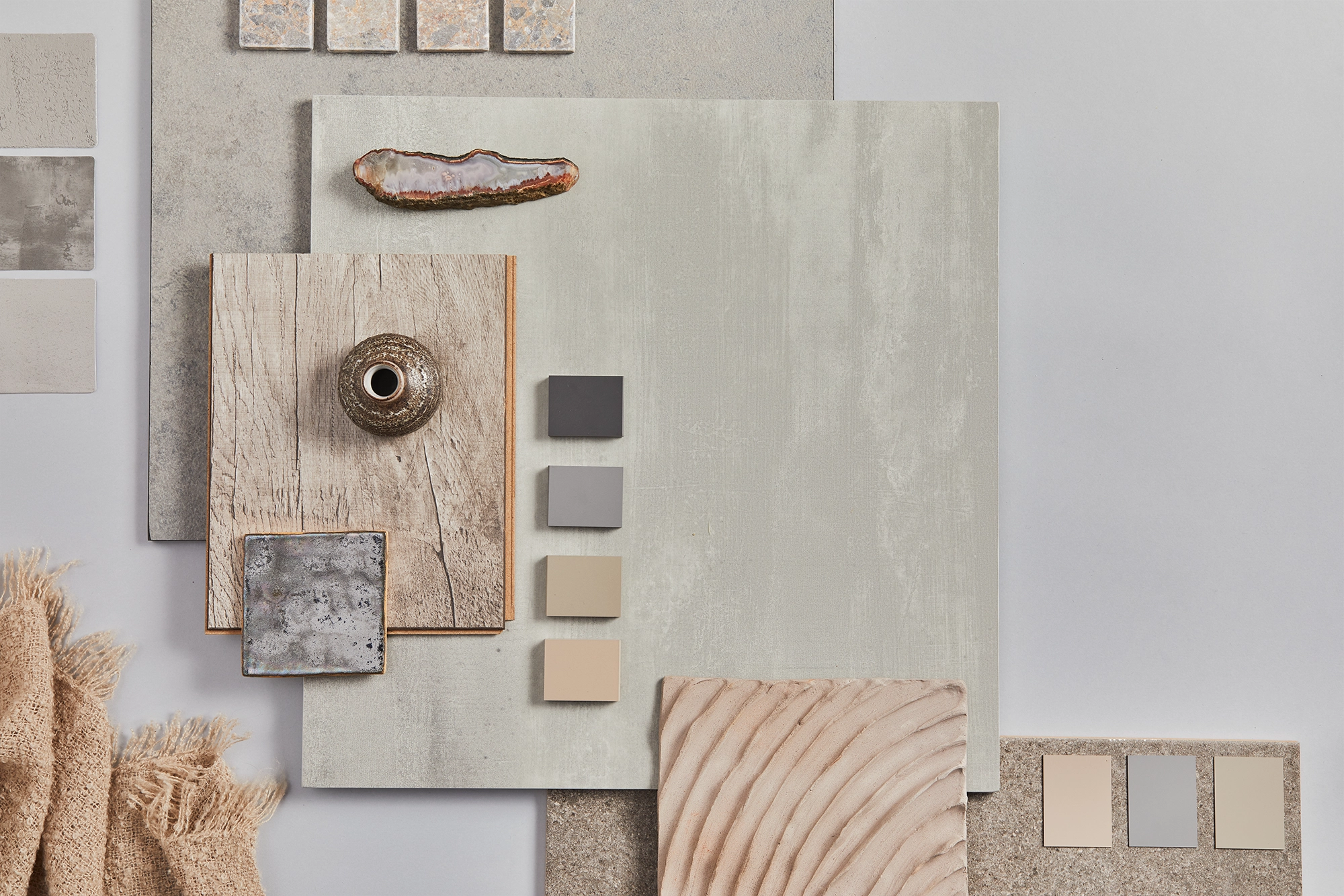Moodboard de materiais naturais utilizados nos empreendimentos AMX Property